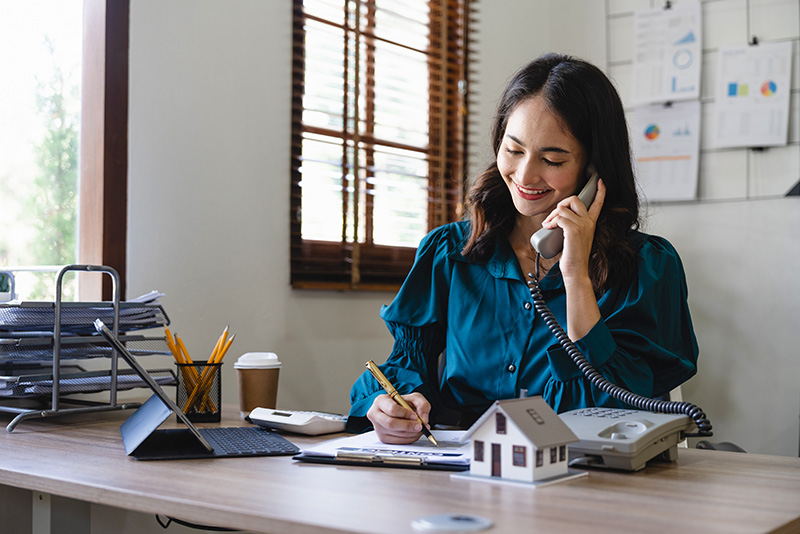 business-owner-on-telephone Business owner utilizing telecommunication services for seamless rural operations.