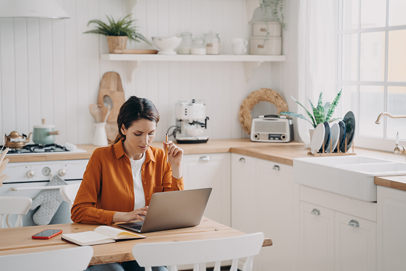 woman-working-from-home-ranch Woman working remotely from a ranch, demonstrating the flexibility of rural broadband services.